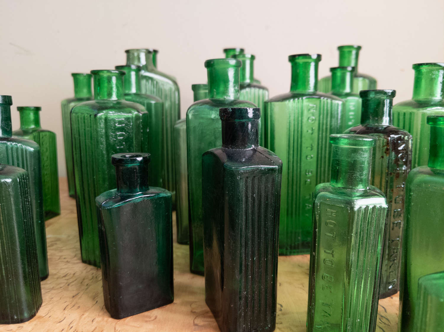 C1880 A collection of 30 Green Glass Poison Bottles