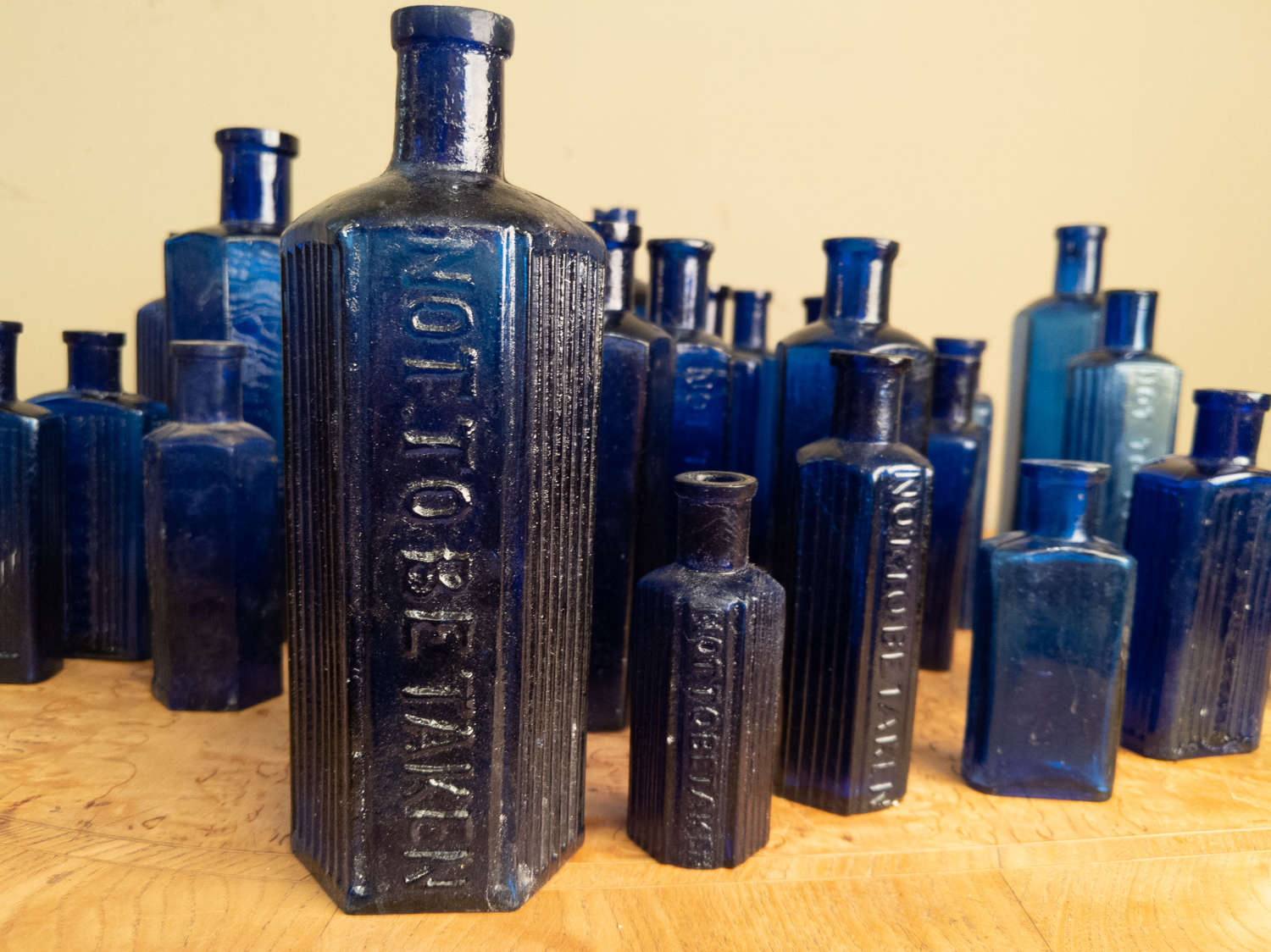 C1880 A collection of 30 Blue Glass Poison Bottles