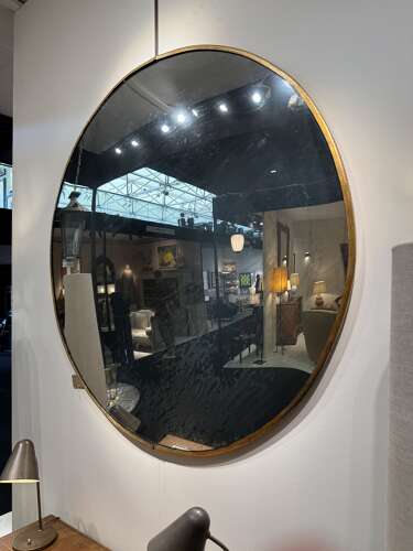 C1950 An Eastern European Large Convex Mirror in Gilt Iron Frame