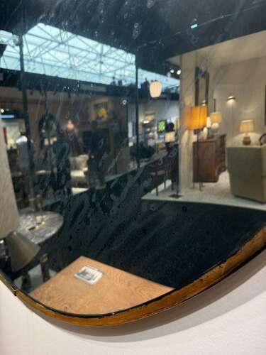 C1950 An Eastern European Large Convex Mirror in Gilt Iron Frame
